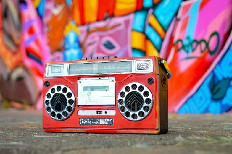 a stereo cassette player sitting on the ground
