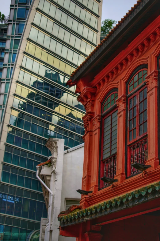 a red building has many windows on it