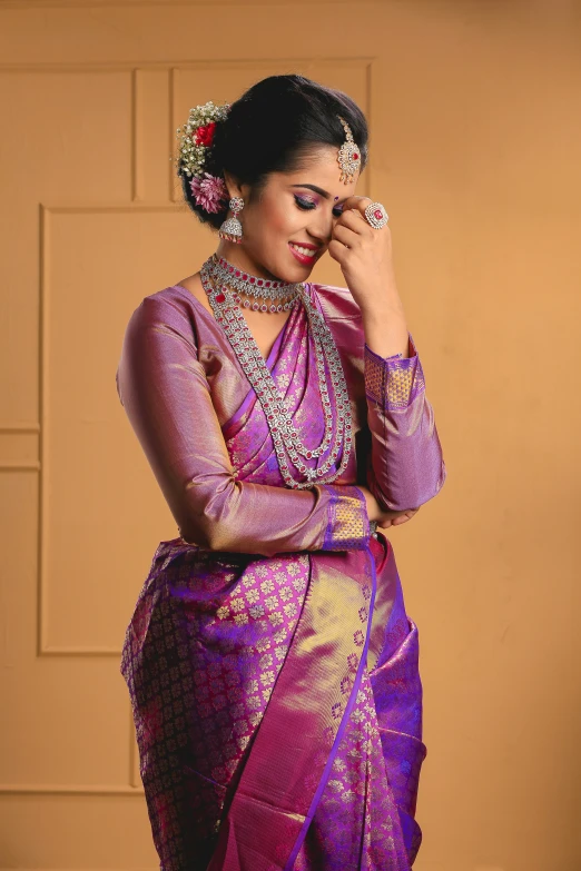 a woman in a purple sari