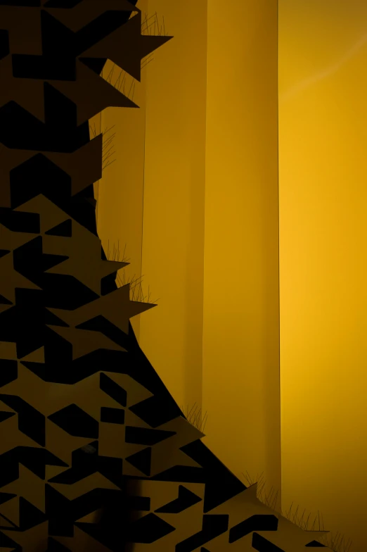 a wall that has some black and yellow designs