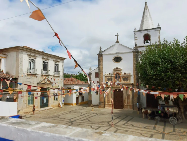 a row of buildings in front of a church