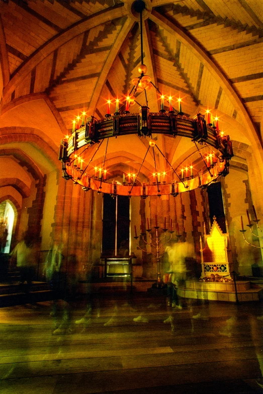 an old building with lights hanging above it