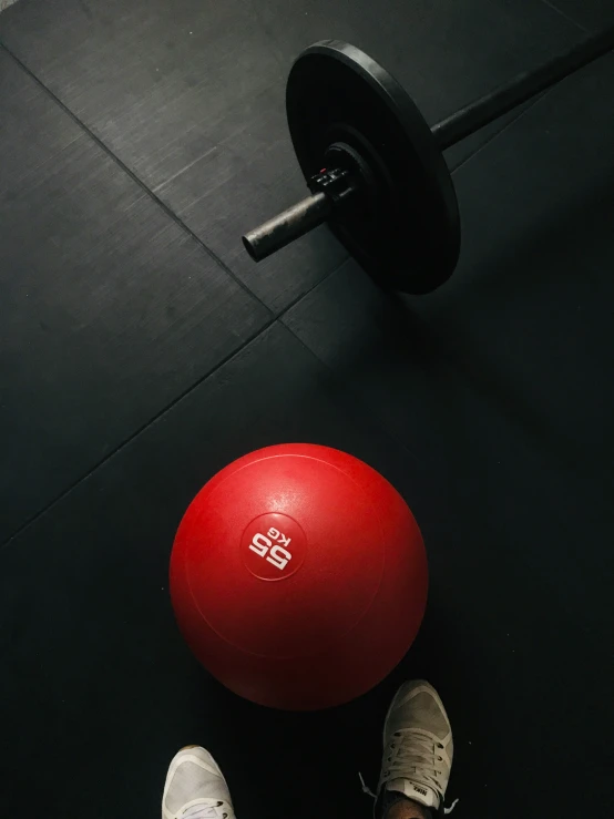 a ball on a weight rope with two shoes in the foreground