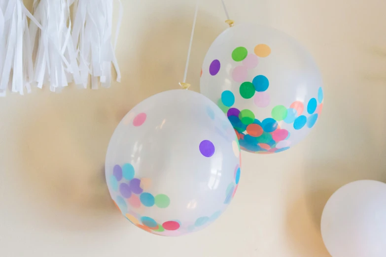 a group of balloons and a hanging decoration