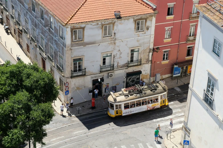 a white bus is parked near a building
