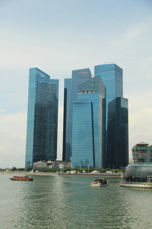 a body of water that has a bunch of buildings in the background