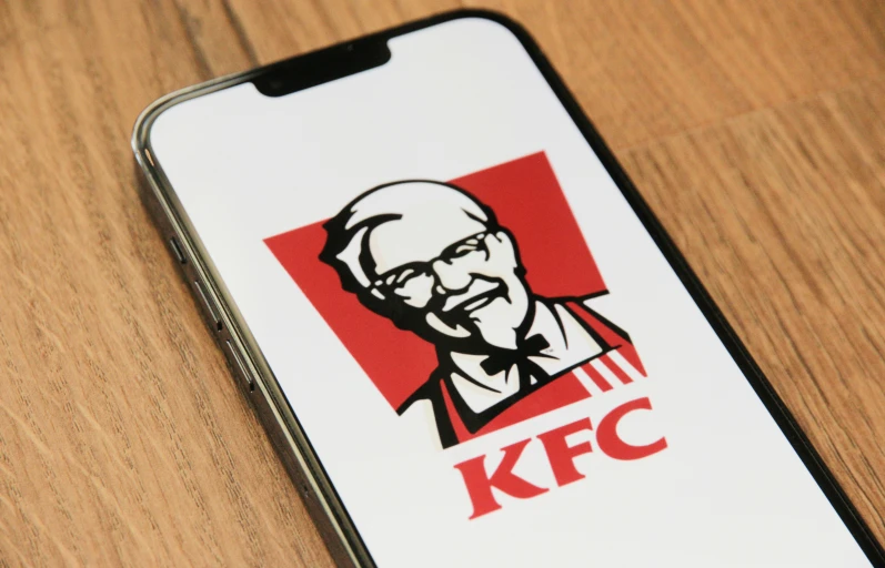 a kfc logo is on an iphone phone