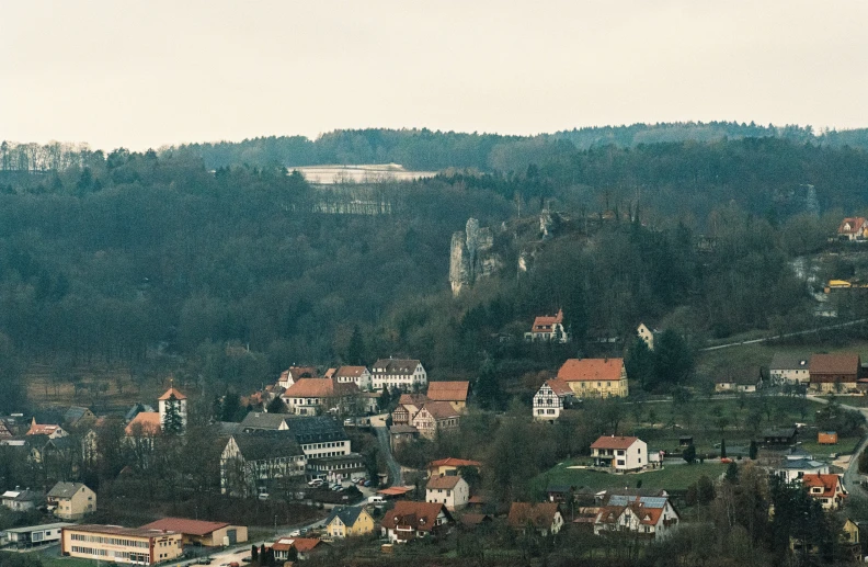 a town in the middle of a green valley