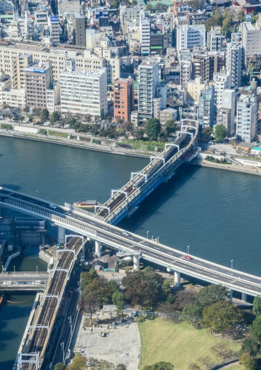 a large bridge that is over water in a city