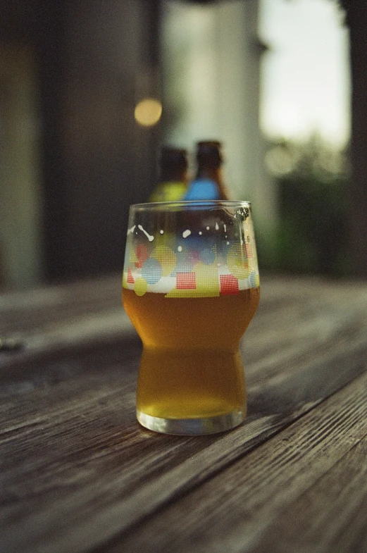 an empty glass is sitting on a table