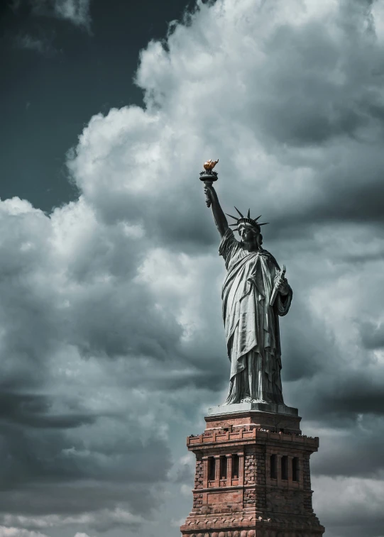 the statue of liberty has the american flag on its head