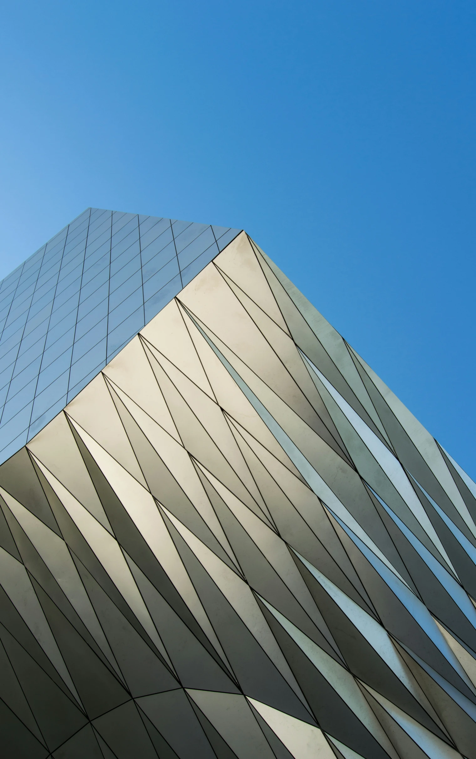 an airplane flying over a tall building in the sky