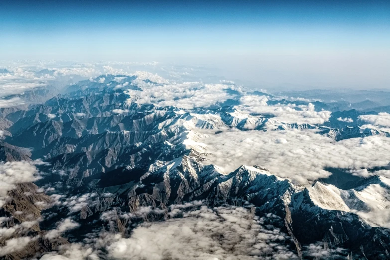 the mountain tops are covered in thick clouds