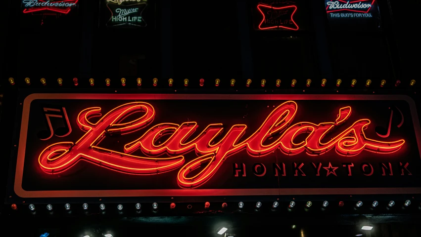 a red las vegas sign lit up in neon