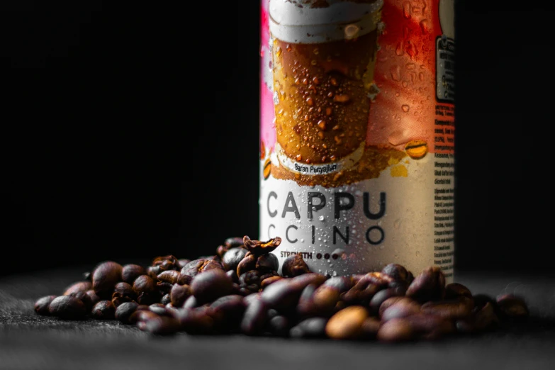 a can of cappuccino and coffee beans spilling out