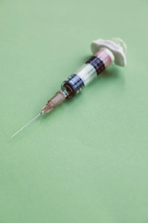 a needle with needle tip stuck in the end