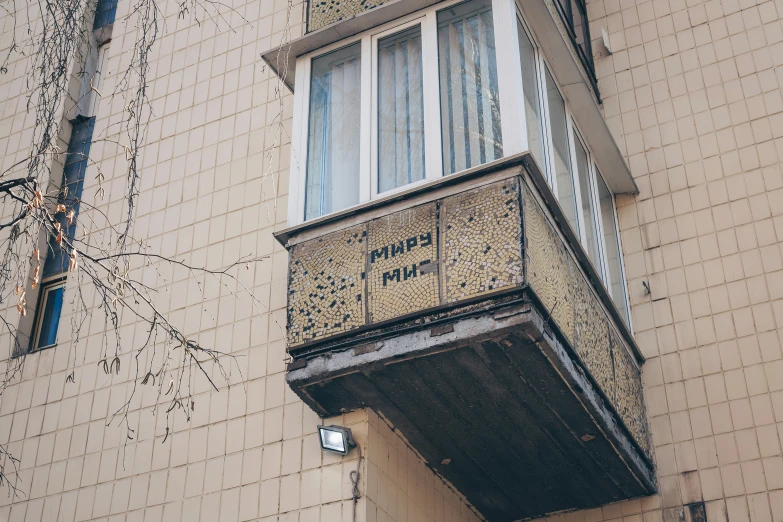 the apartment building is decorated in gold and white