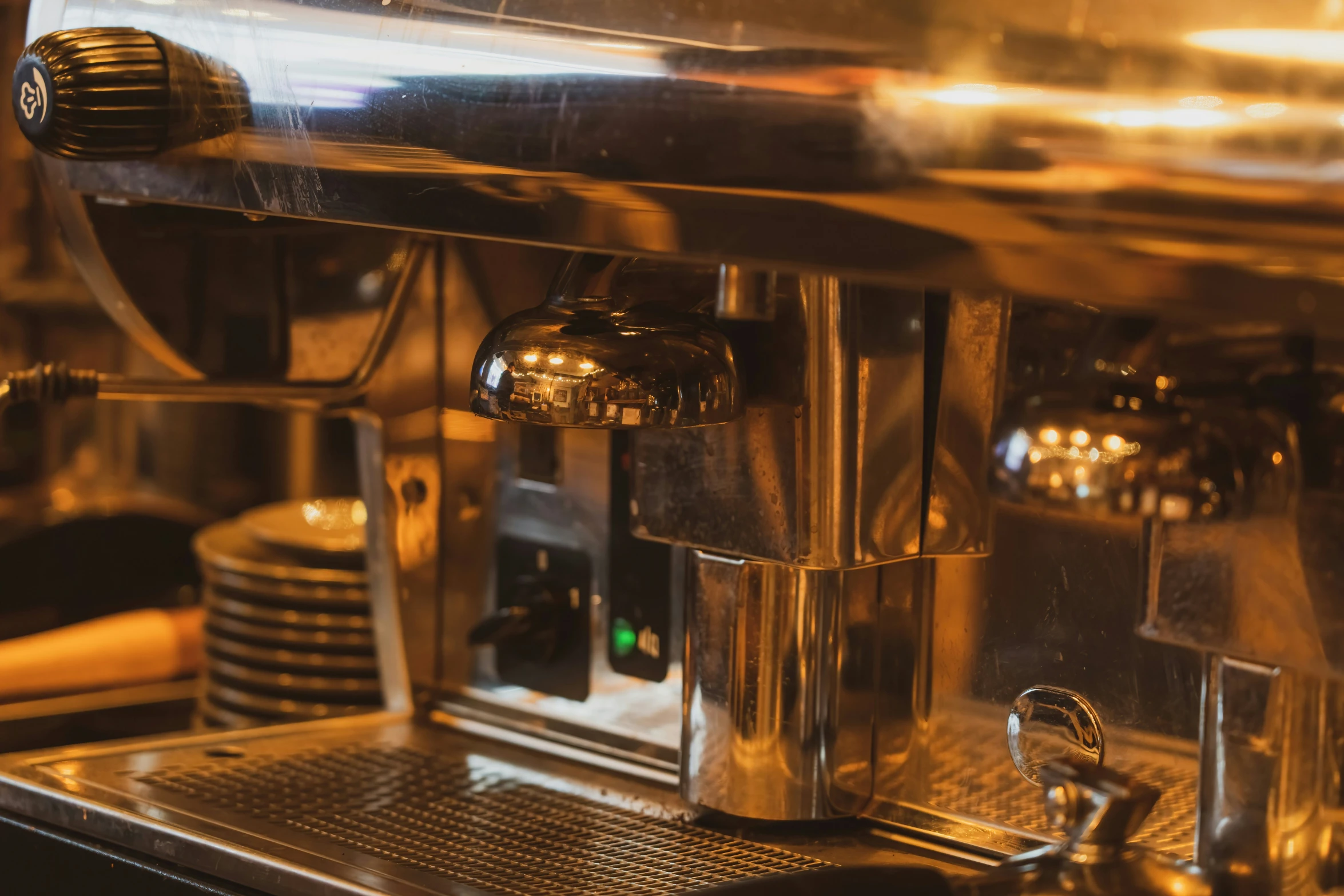 a stainless steel coffee maker sitting on top of a counter