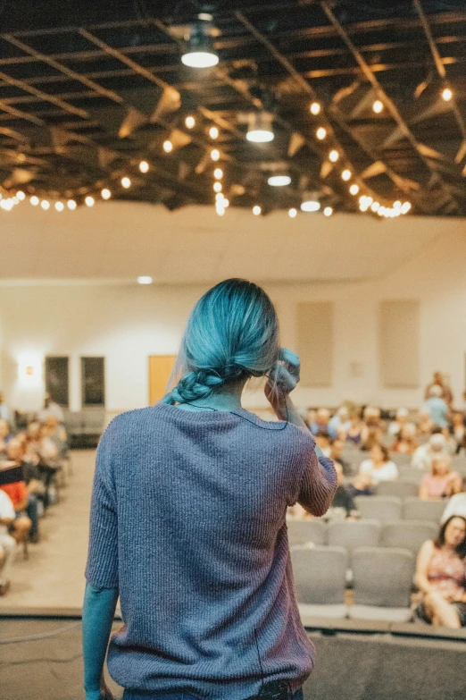 a person is walking and talking on her cellphone