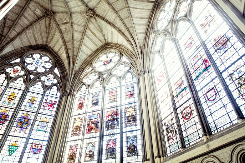 an ornate gothic church ceiling and window with a view of the other churches