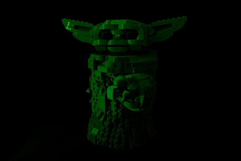 the lego star wars yoda figure is shown in green