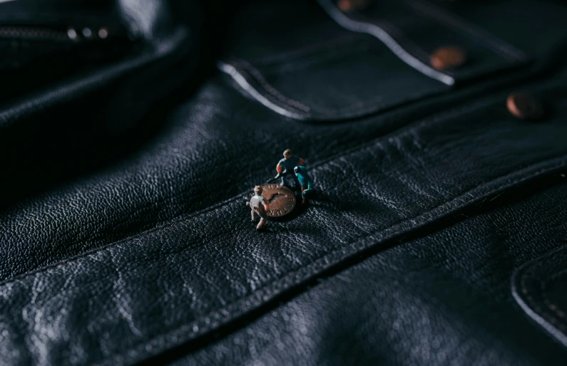 the leather texture of a jacket with ons in the middle