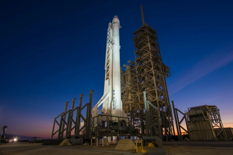 the space shuttle assembly tower sitting tall and holding several other rockets