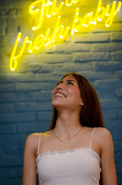 a woman standing in front of a sign