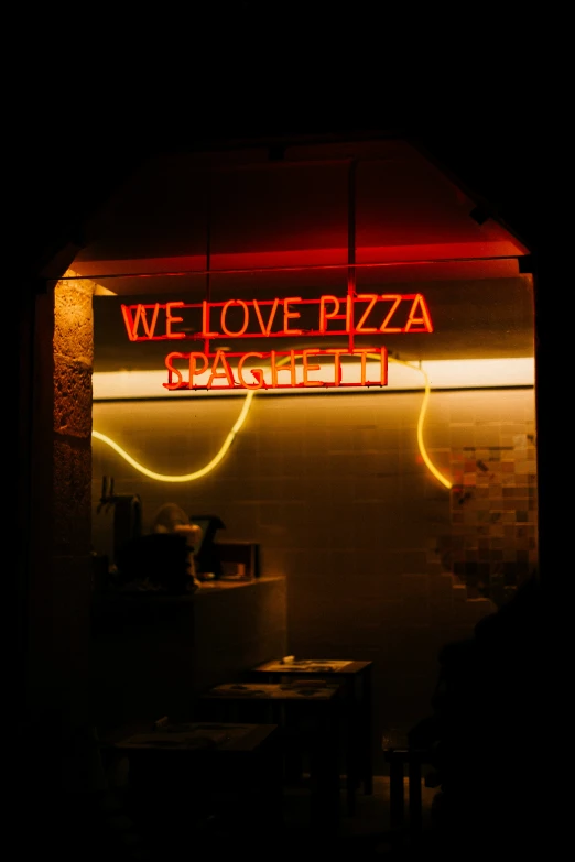 an image of a business sign for pizza mania