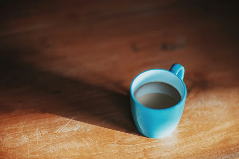 there is a mug sitting on a table