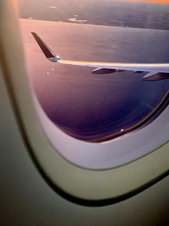 the wing of an airplane, taken from behind