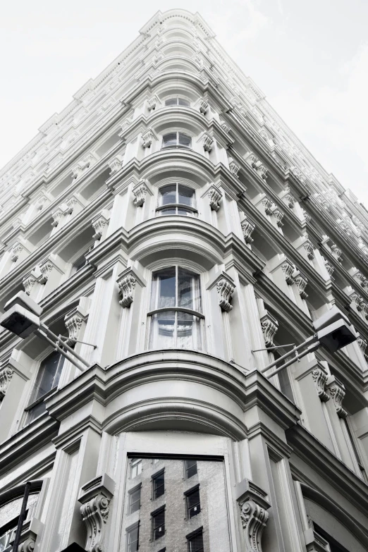 the corner of a large building with many windows