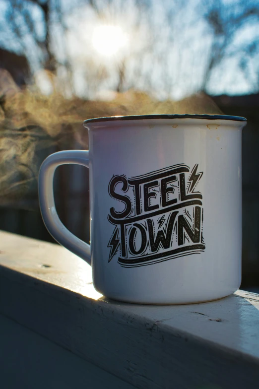 a metal mug that says steel town on it