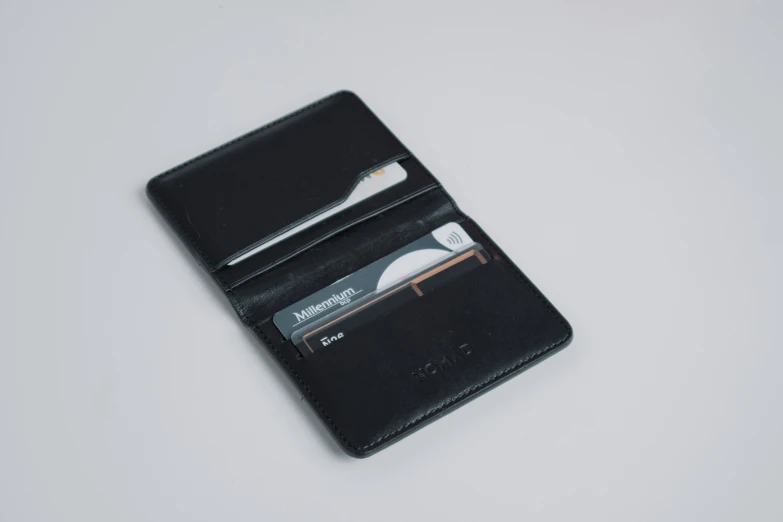 black leather business card holder on a table