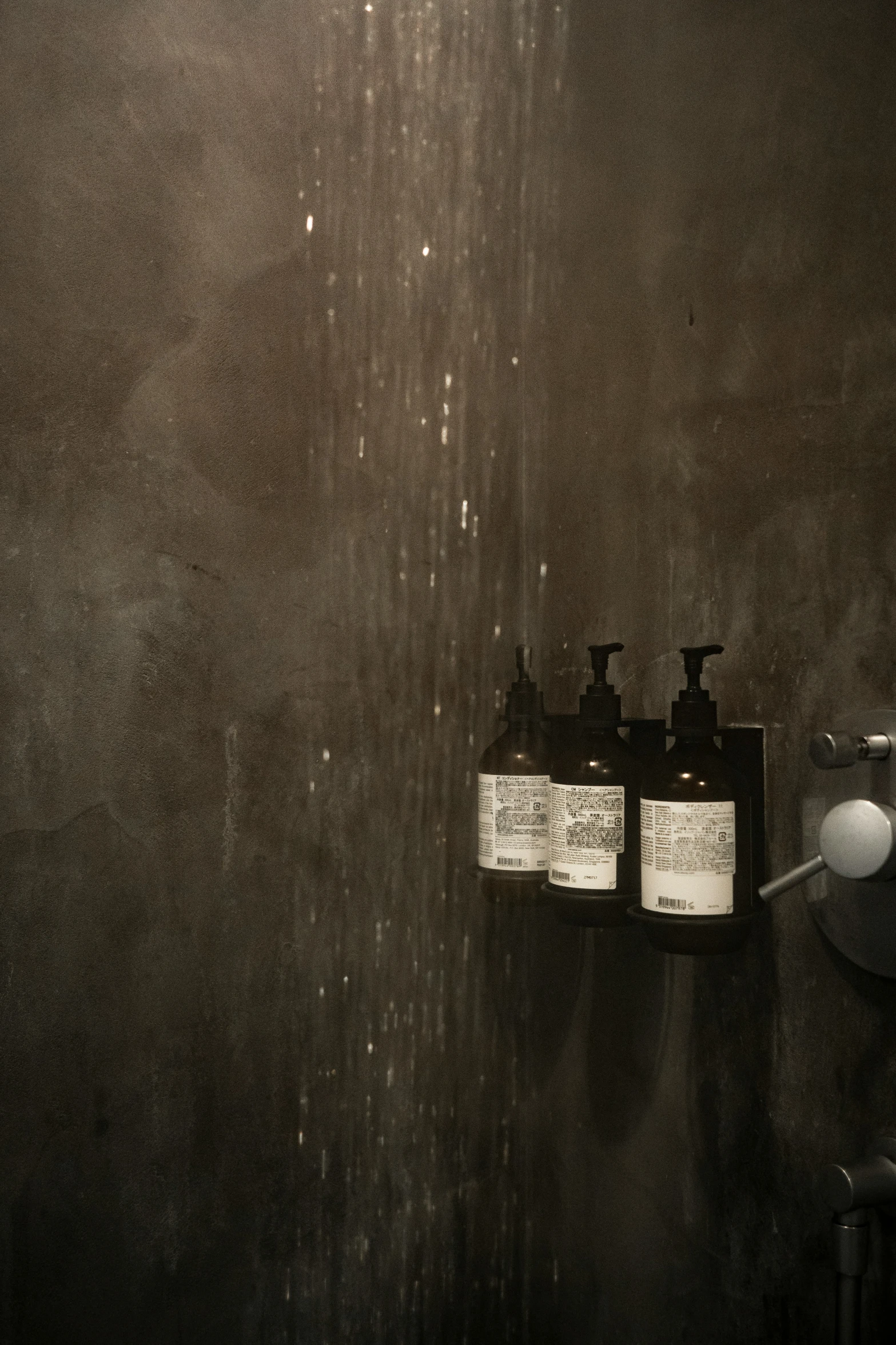 some bottles sitting on the side of a wall