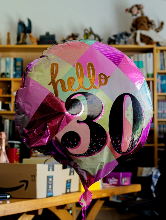 there is a large hello ballon that says hello 66