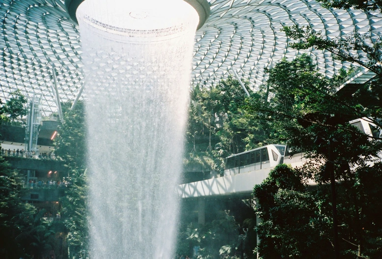 this waterfall is in the middle of a large indoor space