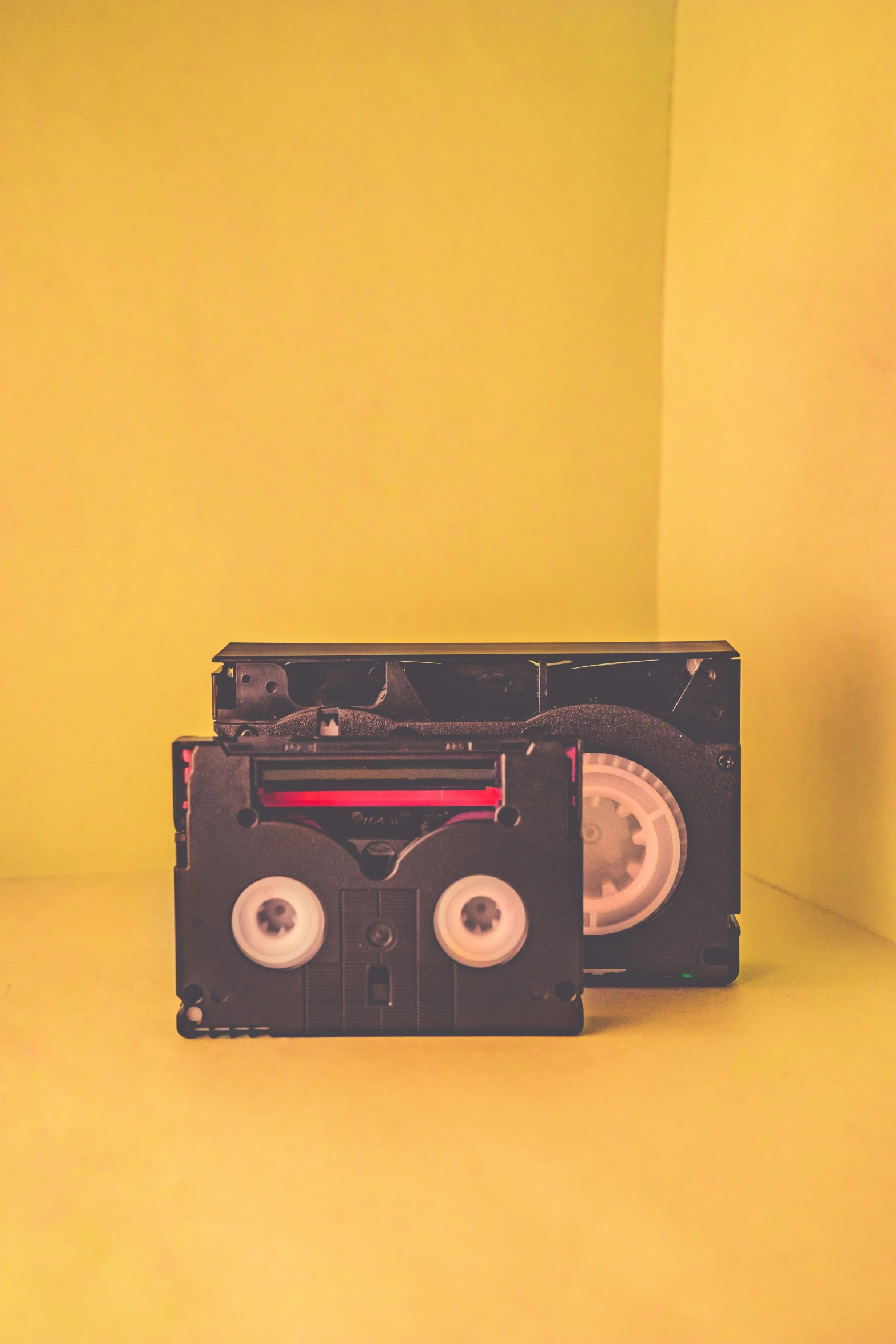 an old fashioned portable radio on yellow background