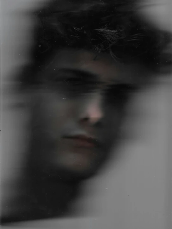 blurry po of a person in front of a window