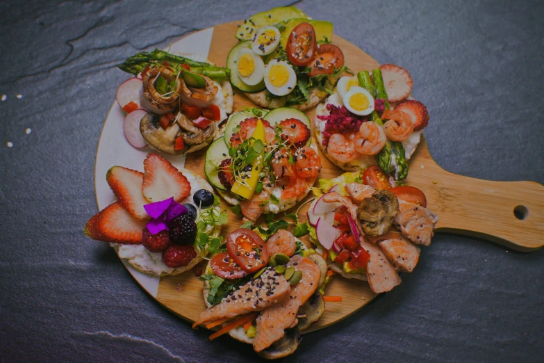 a big white plate topped with seafood and vegetables