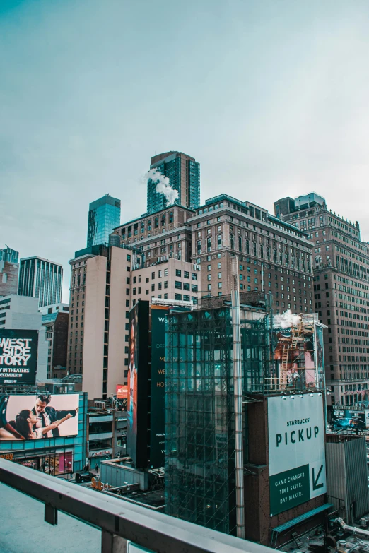 the large billboard is on the side of the tall building