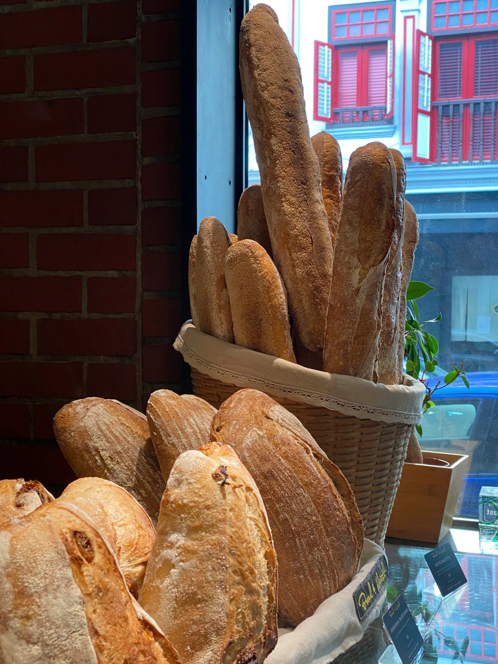 a bunch of bread is sitting next to some other breads