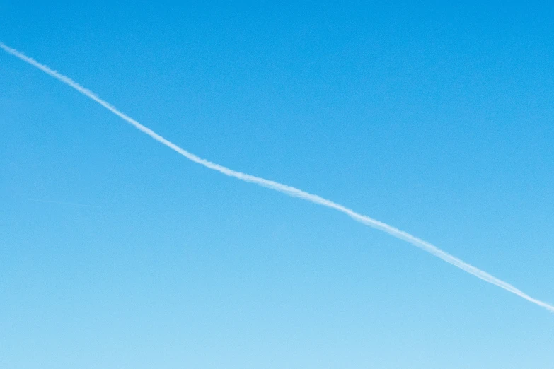 a clear blue sky shows the air in two different directions