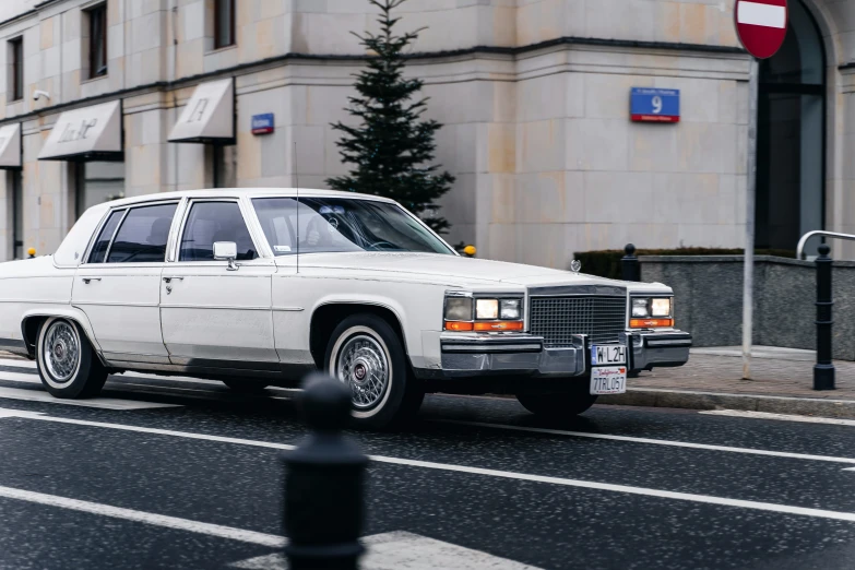 this is a white limousine parked on a street