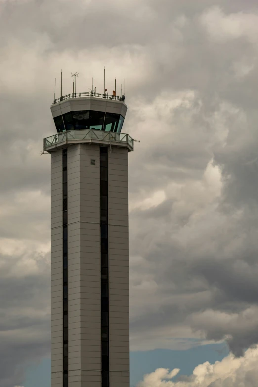 a jetliner that is flying down a cloudy sky