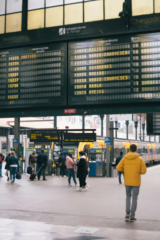 many people are walking around at the station