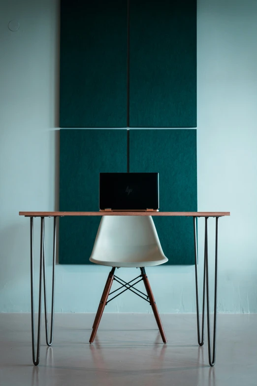 a chair that is sitting near a table