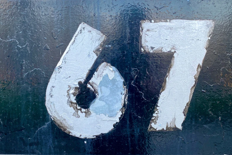 white numbers sitting on top of a window sill