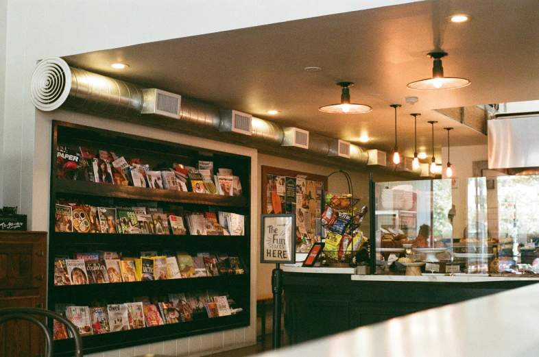 inside of a store with lots of books on shelves