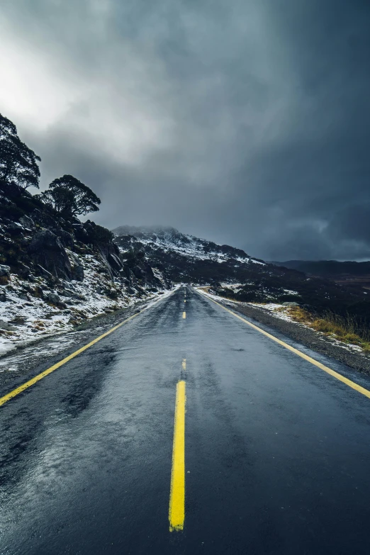 a long road in the middle of a mountain range